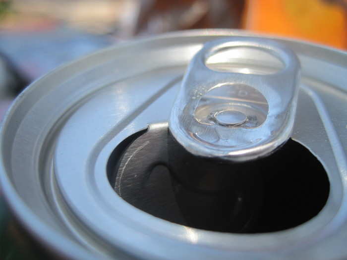 Soda can tab — Cans with stay-tabs (tabs that stay attached) emerged in the mid-1980s to replace pull-away tabs, which are pulled off a can entirely. The new tab