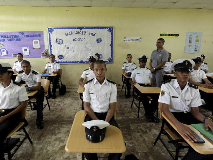 High school students in uniform attend a maritime vocational program at the Artes y Oficios Melchor Lasso de la Vega school in Panama City, Panama.