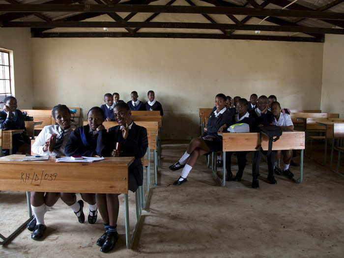 A 12th-grade class at Khabazela High School relax in their classroom in Embo, west of Durban, South Africa. According to the 2011 census, only 41.7% of the South African population had completed a high school education or higher.