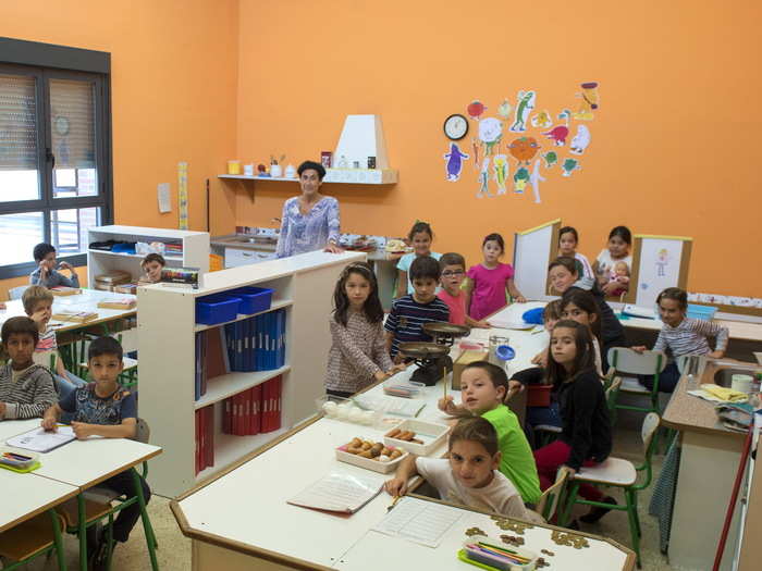 A class from the San Frantzisko public primary school pose for a picture with their teacher, Marisa Solaguren. The school is in the Basque fishing town of Bermeo, on the north Atlantic coast of Spain.