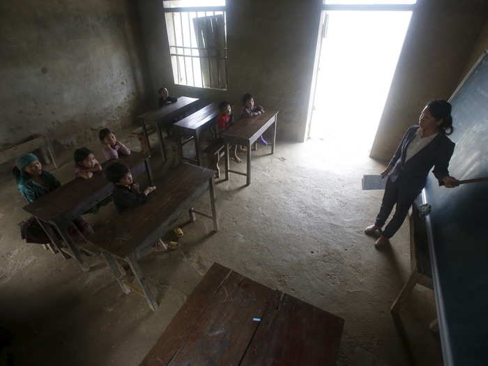 Nguyen Thi Phuong teaches a third-grade class in the primary school of Van Chai in the Dong Van district of Vietnam. Phuong teaches the class in the village where she has lived for 23 years without electricity or books.