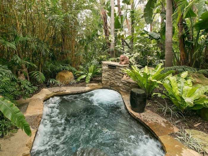 There is also a stone Jacuzzi nestled in the garden.