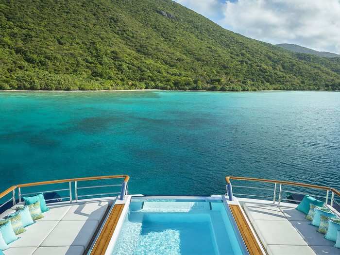 The view from the highest point on the boat — the master suite — looking off the stern onto the clear blue sea of whichever exotic location the Solandge has sailed to.