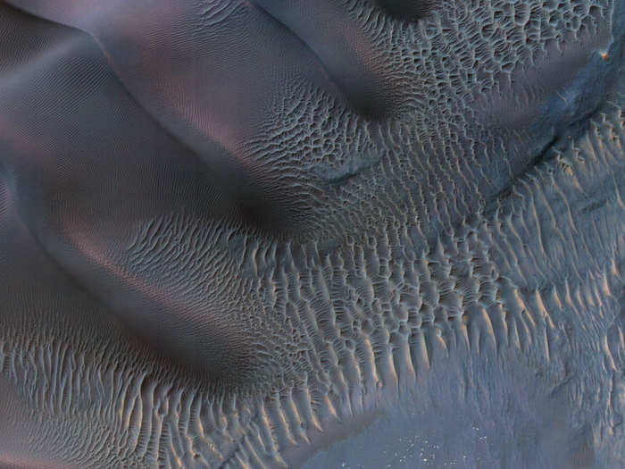 This arresting image of sand dunes in the Noachis Terra of Mars spans a little over half a mile across. The different sizes and shapes of sand dunes are from changes in wind direction and wind strength over time.