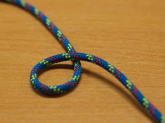 Eagle Scouts are experts at a wide variety of knots. One of them is the bowline, which is used to make a non-slip loop on the end of a rope and is often used for rescue work. To make a bowline, start by first forming a loop on the top of the line.