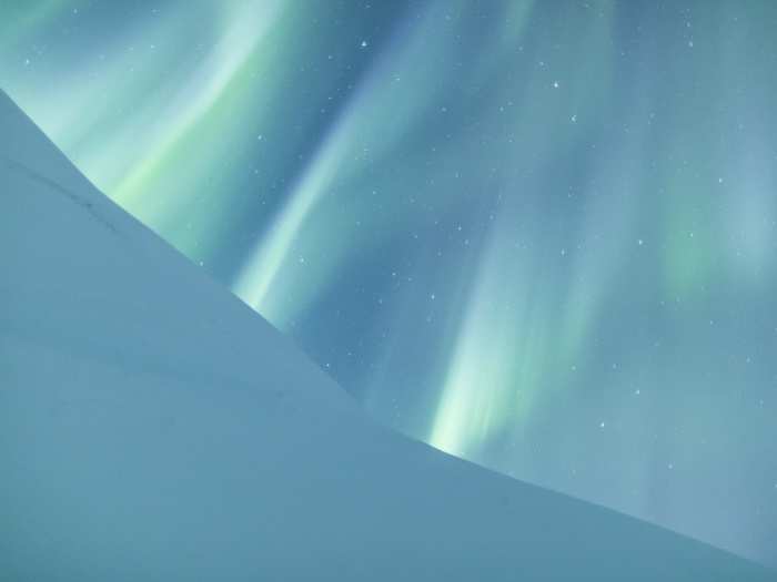 This photo, by Australia-based photographer Jamen Percy, is a breathtaking spectacle of the Northern lights against a snow-covered hill. Percy is an Aurora Borealis expert and leads tours dedicated to "giving you the best possible chances of seeing the Northern lights." Learn more on his website, provided beneath this photo.