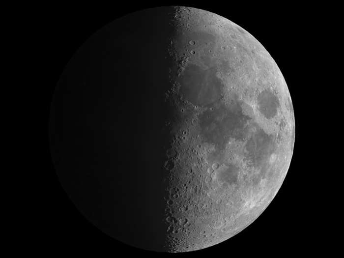 Hungary-based photographer András Papp took this award-winning shot of our moon. One of the judges described this photo as: "The perfect symmetry of this half-moon shot gives it a very striking appearance and the combination of crisp detail on the sunlit side and the faint glow of reflected Earth-light on the dark side is very impressive."