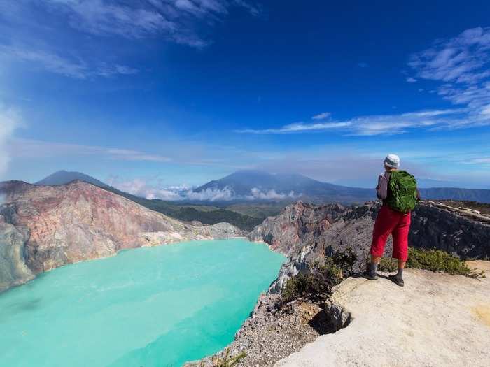 In the heart of the Ijen crater, which is located on the Indonesian island of Java, is a crystal-blue lake that sharply contrasts with the surrounding environment. Though the lake has high levels of acidity, tourists often flock to the area to witness its stunning beauty.