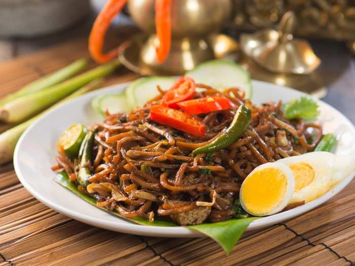 Mie Goreng is an Indonesian dish that features spicy and flavorful fried noodles cooked with garlic, onion or shallots, various meat and seafood options, chili, eggs,and vegetables like cabbage and tomatoes.