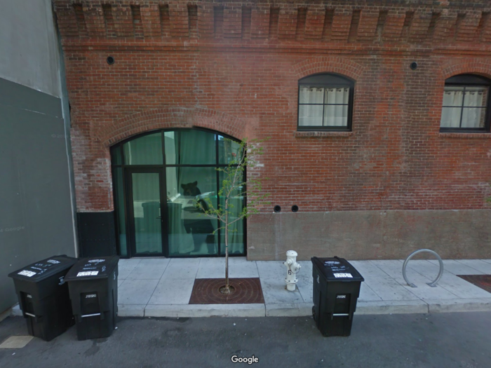 A bear looks out of an office window in San Francisco, California.