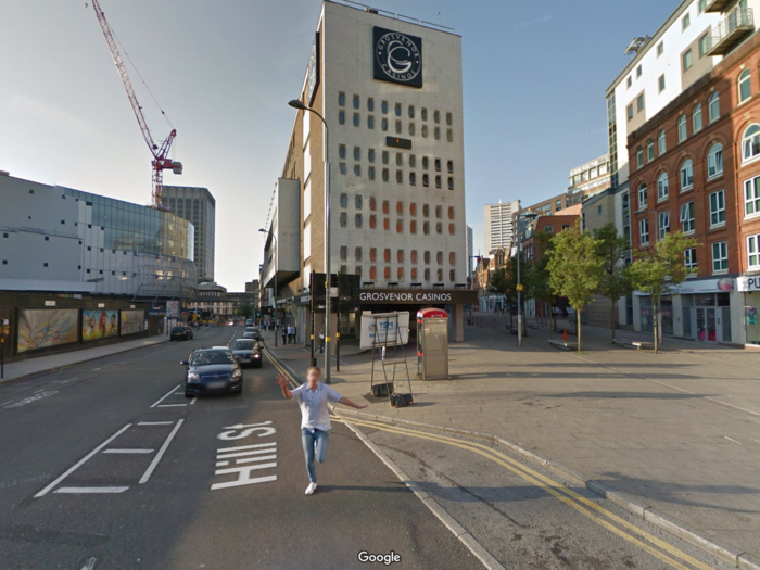 Meanwhile in Birmingham, England, a drunk man chases after the Google car.