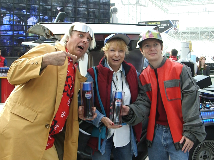 "Doc" and Marty posed with each participant in front of the DeLorean.