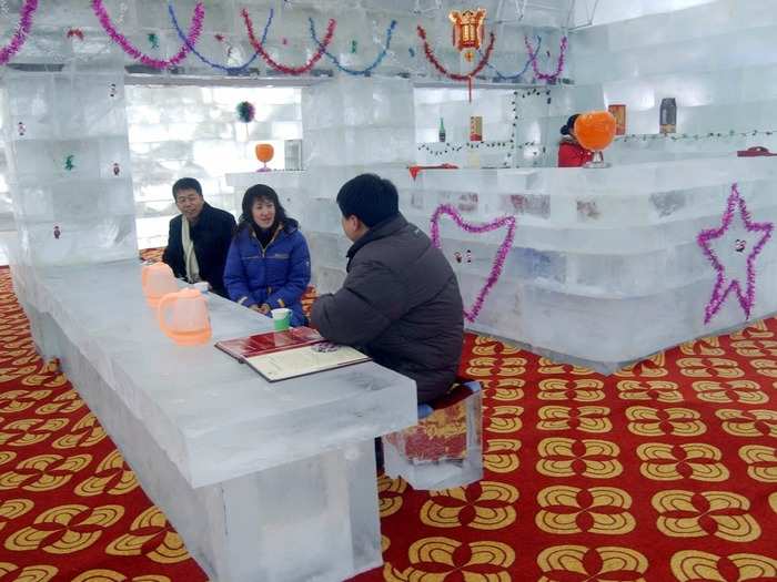 Diners sit inside a restaurant made of ice in Harbin, China. The restaurant seats about 100 people and is part of the ongoing Sun Island Snow Carving and Ice Sculpture Exposition.