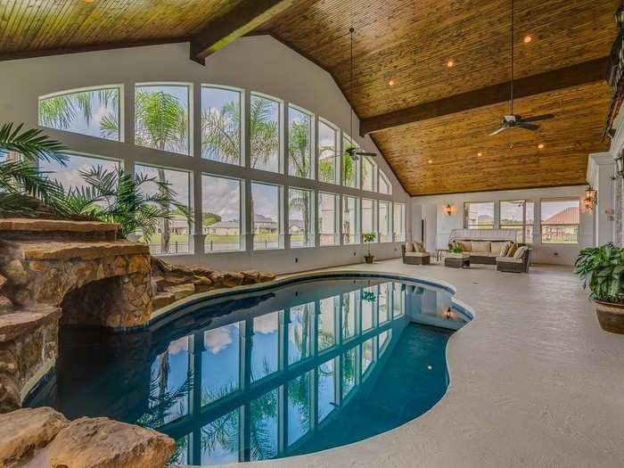 As you pass the lagoon-style indoor pool, a staircase beams you right into...