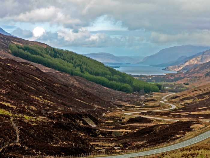 Drive through the Scottish Highlands and admire the gorgeous hilly terrain.