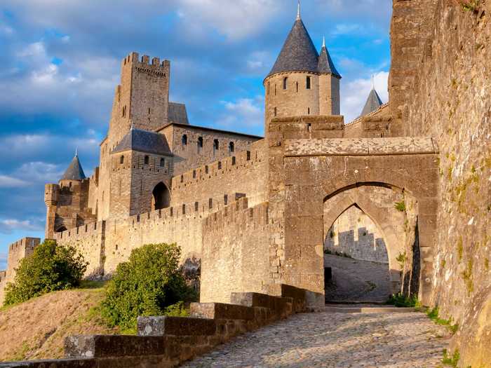 Stroll the ramparts of the medieval fortified town of Carcassone in France — complete with a castle and Gothic Cathedral.