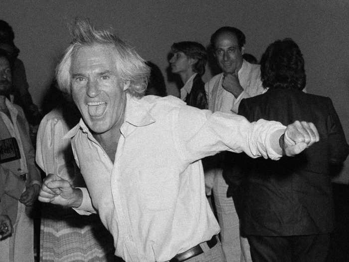 Timothy Leary, the former American psychologist and writer known for advocating psychedelic drugs, dances while celebrating a post-premier party for the opening of the "Sgt. Pepper
