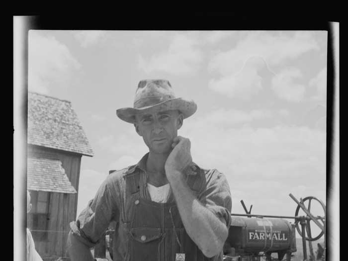 A former tenant farmer on a large cotton farm is now a tractor driver on the same farm in Bell County, Texas. He gets paid one dollar a day.