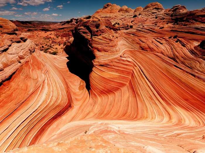 ARIZONA: Reaching the Wave in Arizona requires both a permit and a rigorous hike. But the awe-inspiring view makes this attraction well worth the journey.