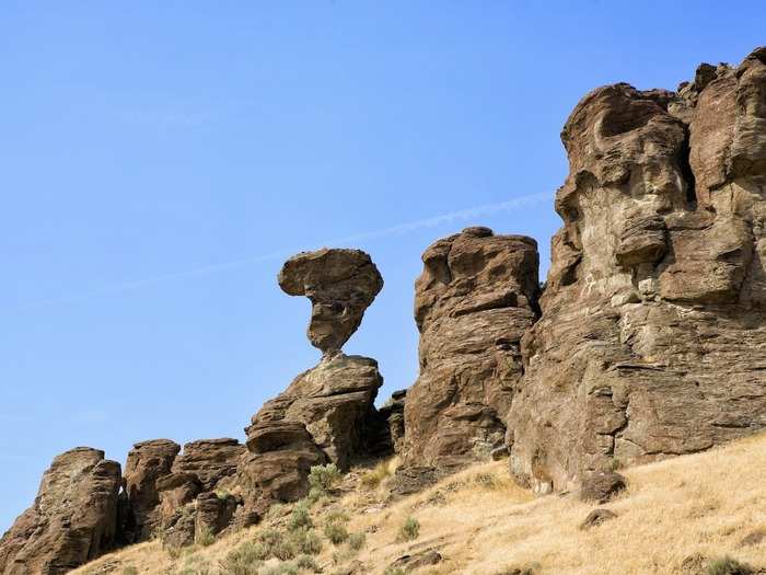 IDAHO: Balanced Rock is exactly what it sounds like: a 48-foot rock that is perched precariously on an approximately 3-foot pedestal. After getting a close-up look at the rock, have a picnic in nearby Balanced Rock Park.