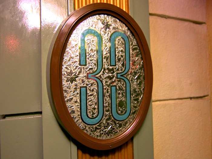 The club entrance is "hidden" from the average Disney goer thanks to the color "no-see-um-green." The paint color was designed by Walt Disney to blend into the background.