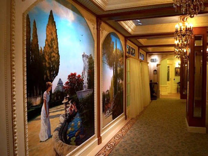 The walls of Club 33 are lined with paintings — Doyle said they made the theme "The Princess and the Frog."