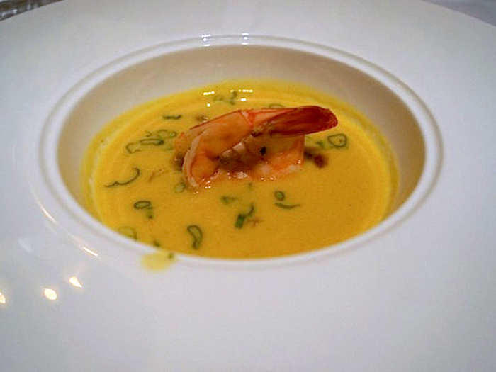 He chose summer corn broth with tomato relish, sausage, and gulf shrimp for his second course.