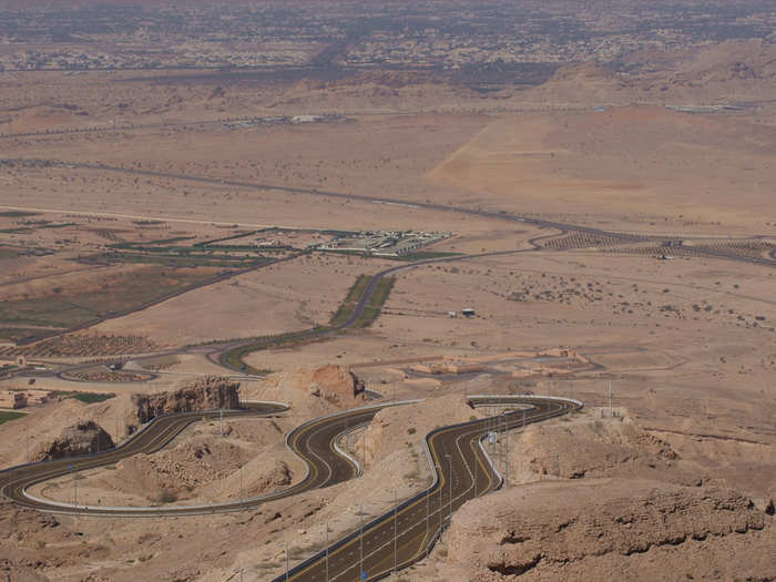 Jebel Hafeet Mountain Road in Abu Dhabi winds up the craggy limestone of to Jebel Hafeet Mountain, the second-tallest mountain in the United Arab Emirates. Take the  drive in late afternoon so you can catch the sunset from the top of the mountain.