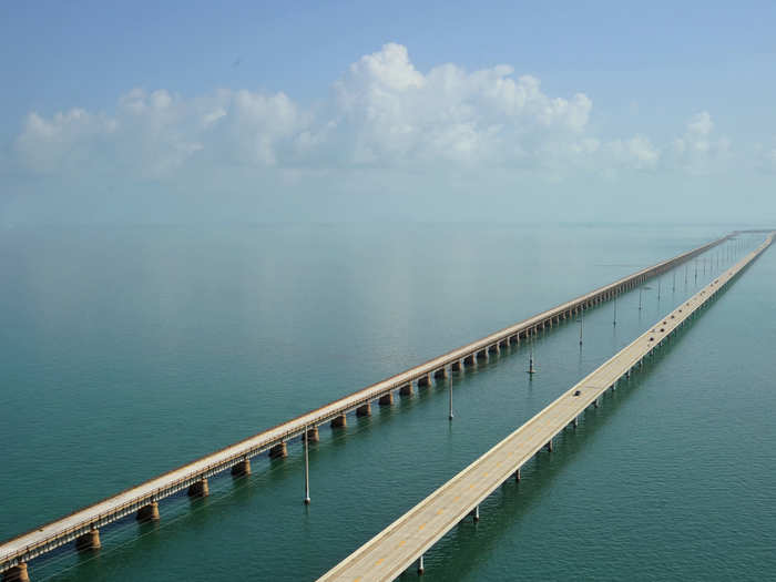 The Overseas Highway in Florida connects mainland Florida to the Florida Keys and consists of 42 overseas bridges across 113 miles. You