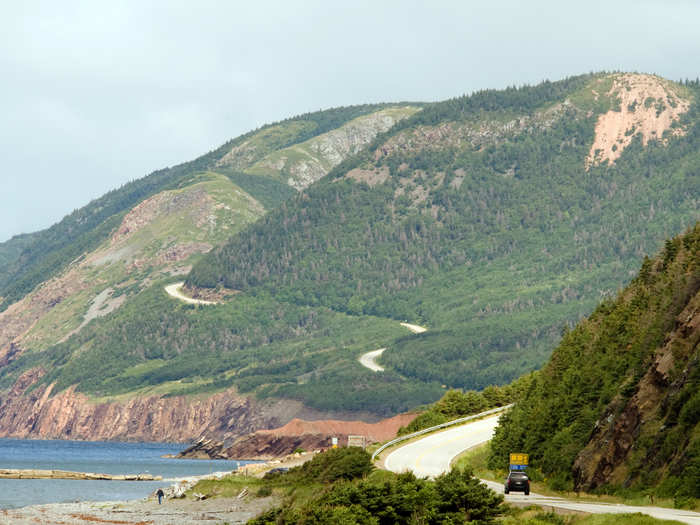 Cabot Trail in Nova Scotia is one of the most scenic drives in Canada, winding around the greater part of Cape Breton Island and offering views of both the woods and the ocean. Make sure to glance at the water every once in a while — you might spot a pod of whales swimming past.