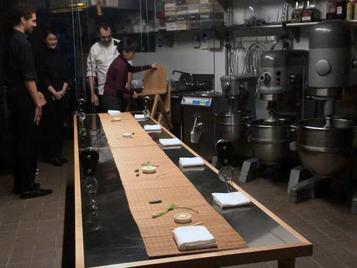 The table literally descends from the ceiling with the turn of a crank. Suddenly, the industrial kitchen is a chic dining room.