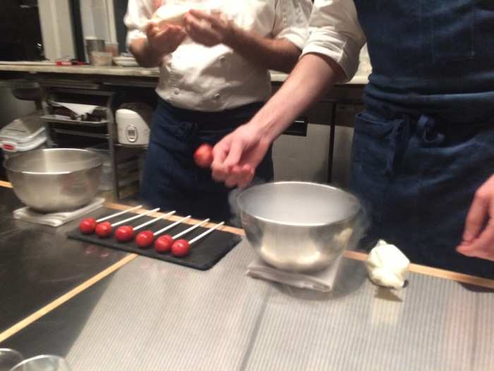 "First dance" made use of liquid nitrogen. The chefs dipped strawberry lollipops into the bowl...