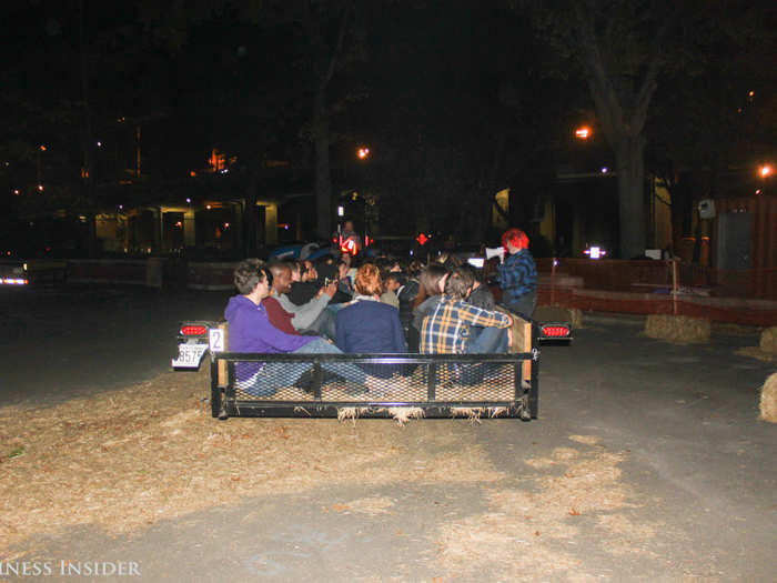 A group of around 20 people were loaded into each truck, where each person sat in hay.