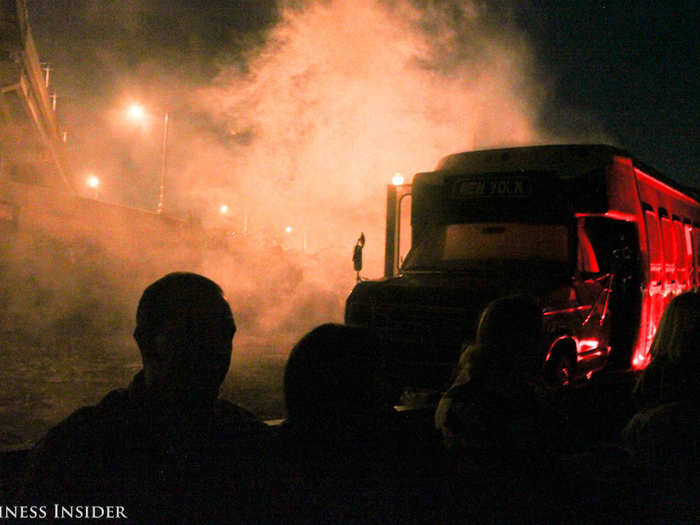 After going under the bridge, we saw a bus bathed in red light on one side, plus some dark silhouettes who were banging on the window inside.