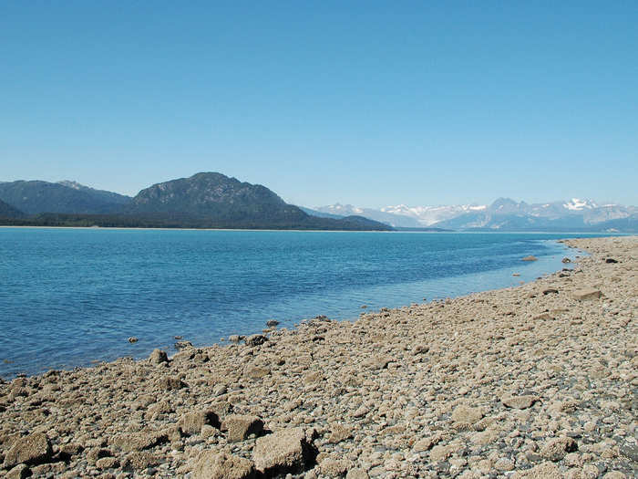 MUIR GLACIER NOW: By 2005, Muir Glacier had retreated more than 31 miles. Although this picture was taken from the same location as the early black-and-white photograph, the glacier is  completely out of view. There