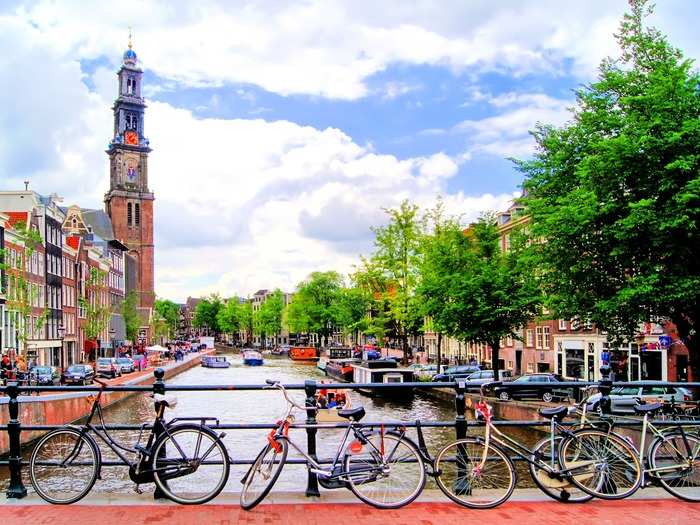 17. AMSTERDAM, NETHERLANDS — With its picturesque canals, windmills, and plenty of bikes, Amsterdam is much more than its Red Light District. From bars and cafes to luxury shopping, local markets, and museums, the city is full of things to do.