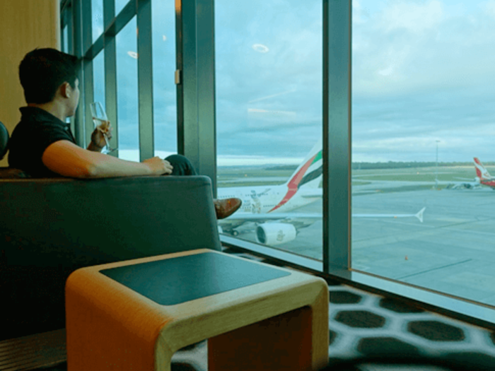 After a quick breakfast, I decided to get a refill of champagne and sit on one of the many spacious couches lying around the lounge. As I made myself comfortable, the lounge assistant came over with my carry-on and put it next to me, without me even asking.