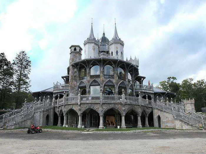 The home has three levels, a massive lower-level garage, and impressive Gothic architecture. Imagine trick-or-treating at this house for Halloween.