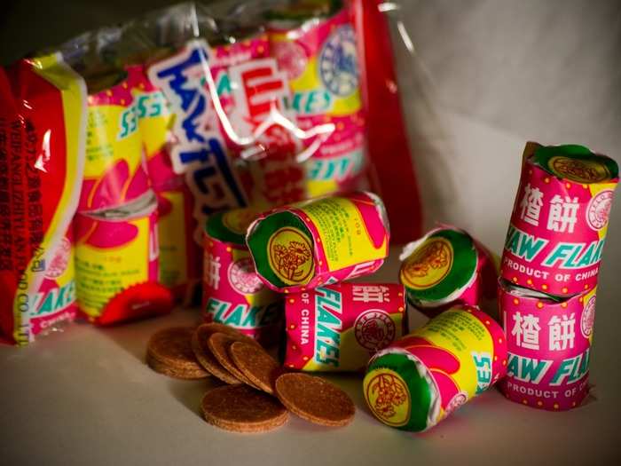 Haw flakes are sweets made from Chinese hawthorn fruit. The tangy dark pink candy usually comes in disks, and it packs a tart punch.