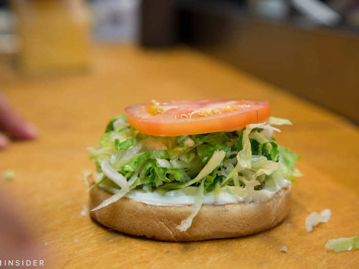 Meanwhile, my Double Charburger started to take shape. Mayonnaise made with real buttermilk was placed under shredded lettuce and tomato.