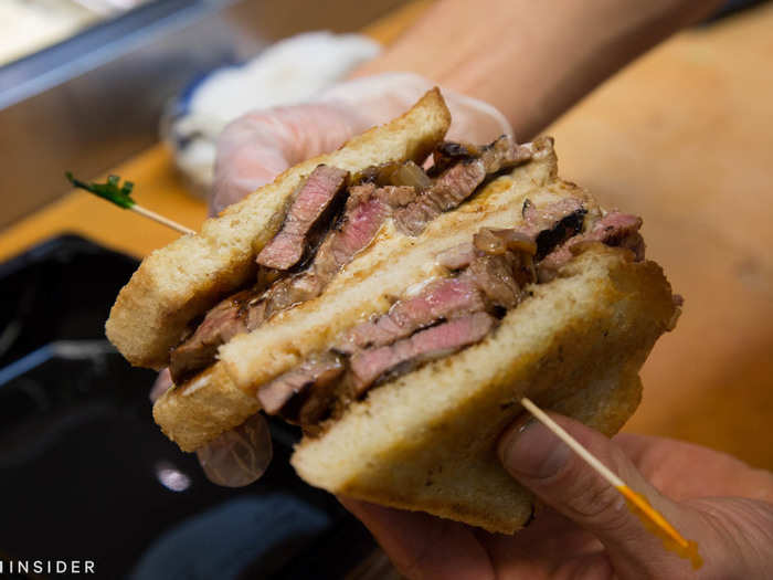 Sandwiched between thick slices of toasted sourdough and complimented with caramelized onions, mayo, and your choice of BBQ or teriyaki sauce, it looks like a carnivore