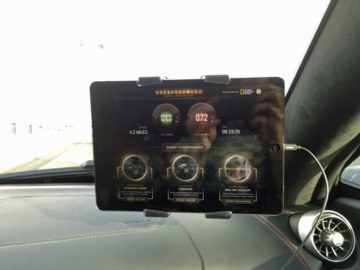 My driver pointed out a temporary iPad display in front of me. This is where I learned all about the car