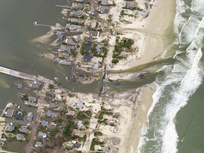 An inlet that was created by the storm connects the Atlantic Ocean and the Jones Tide Pond, just north of where Hurricane Sandy made landfall in Ocean County, New Jersey.