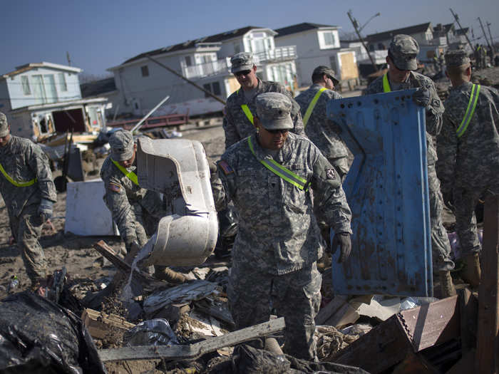 US Army soldiers clear debris from Breezy Point.