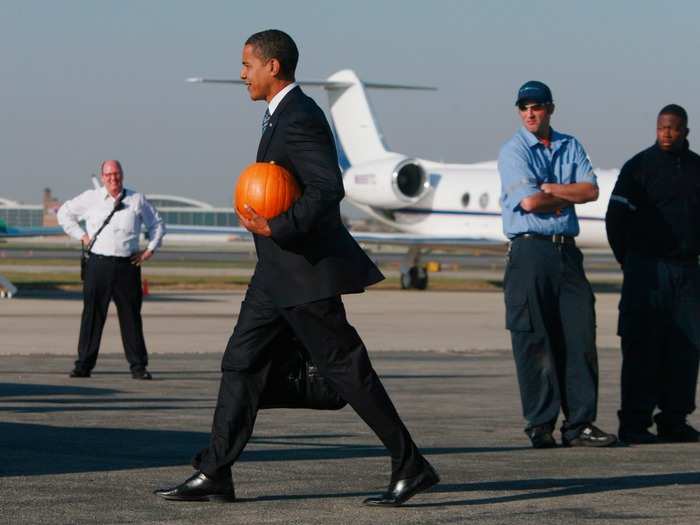 President Obama does not dress up for Halloween in public, though he is not opposed to carrying his own pumpkin. Here he was on October 31, 2008, in Chicago, right before he would win the election.