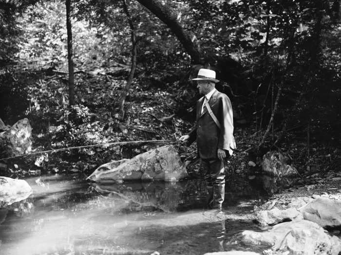 Herbert Hoover fishing in Mills Creek at his Rapidan Camp in Shenandoah National Park, Virginia, also known as "Camp Hoover" (1932)