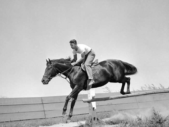 Ronald Reagan taking a hurdle with his horse, Tar Baby, in Van Nuys, California (1948)