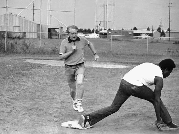 Jimmy Carter running for first during a softball game (1976)