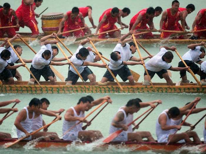 Despite a heavy rainstorm, Guizhou province, China, holds a dragon boat race during its annual Dragon Boat Festival.