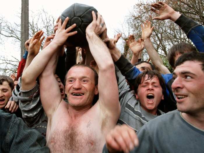 During a Lelo match, a 35-pound ball is hoisted overhead by hundreds of participants in Shukhuti, Georgia. The goal is to move the ball from one village to another, all while each participant fights for control.